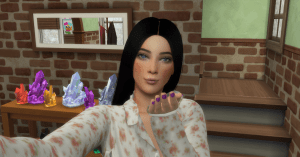 An attractive young adult female Sim blows a kiss at the viewer. 
